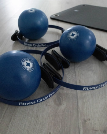 Pilates accessories: balls and circles to diversify workouts on mats or reformers.