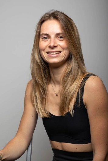 Portrait of Florentine, certified Pilates instructor specializing in Reformer, Tower, Cadillac, prenatal and postnatal Pilates.